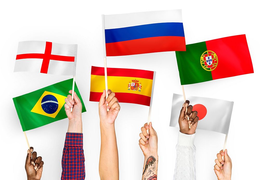 Hands waving the flags of England, Spain, Japan, Portugal, Russia, and Brazil