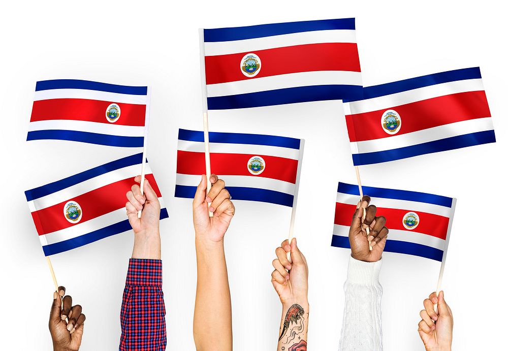 Hands waving the flags of Costa Rica