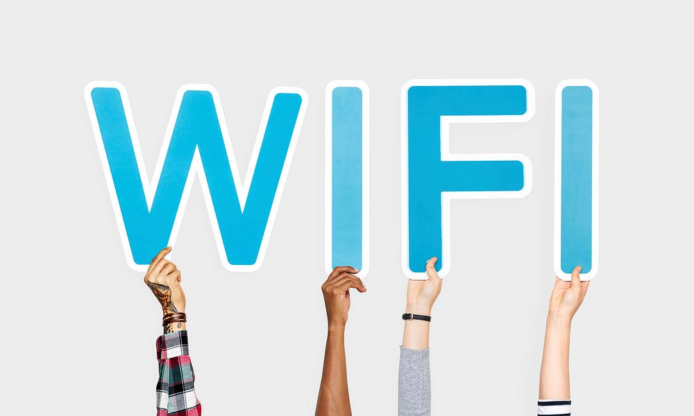 Hands holding up blue letters forming the word wifi