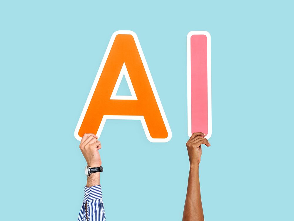 Hands holding up colorful letters forming the abbreviation AI