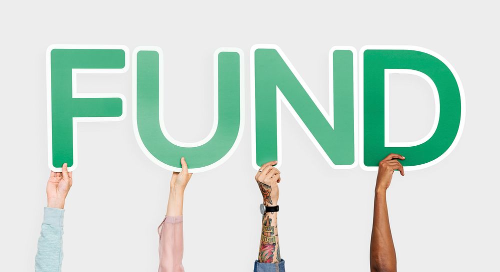 Hands holding up green letters forming the word fund