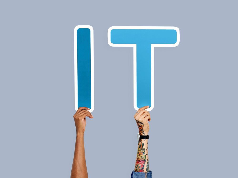 Hands holding up blue letters forming the abbreviation IT