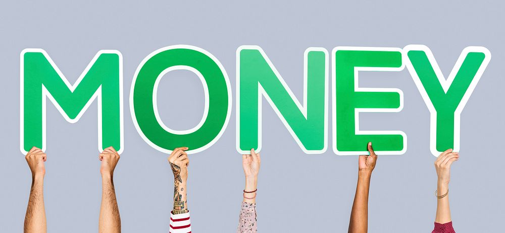 Hands holding up green letters forming the word money