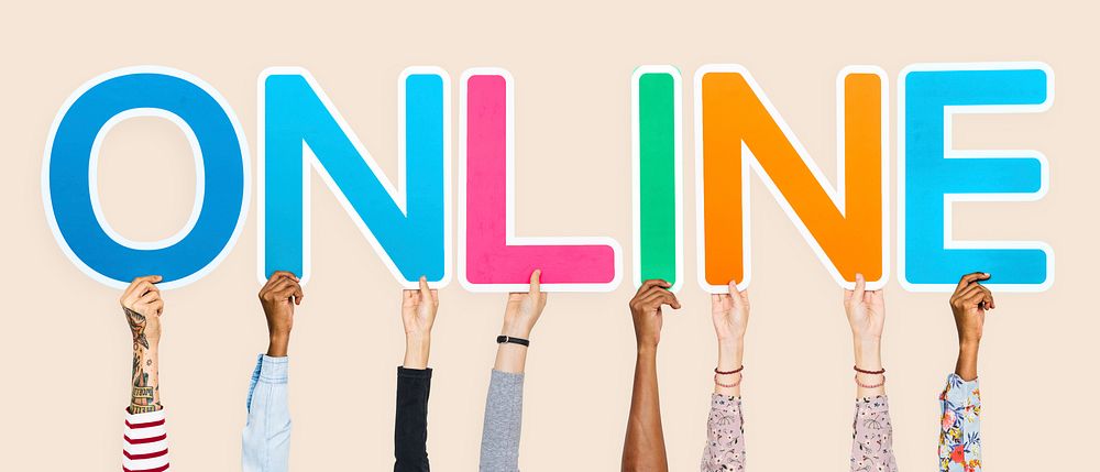 Hands holding up colorful letters forming the word online