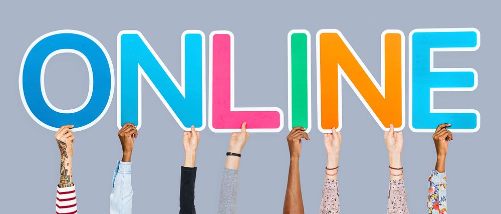 Hands holding up colorful letters forming the word online