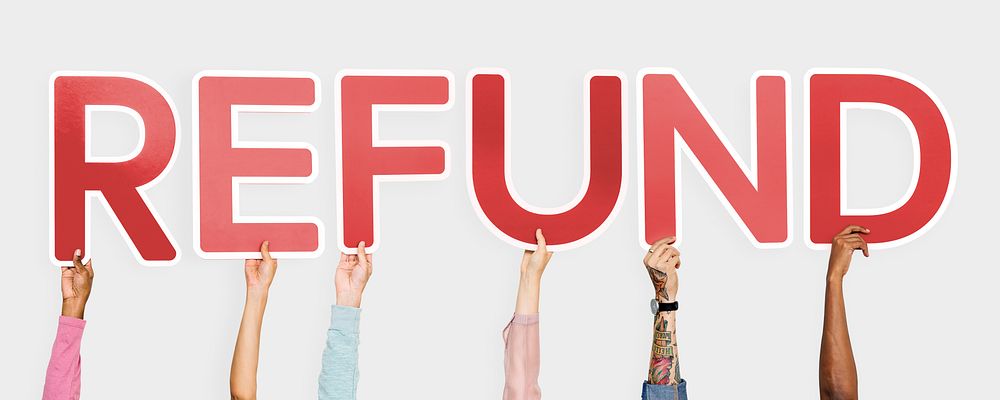 Hands holding up red letters forming the word refund
