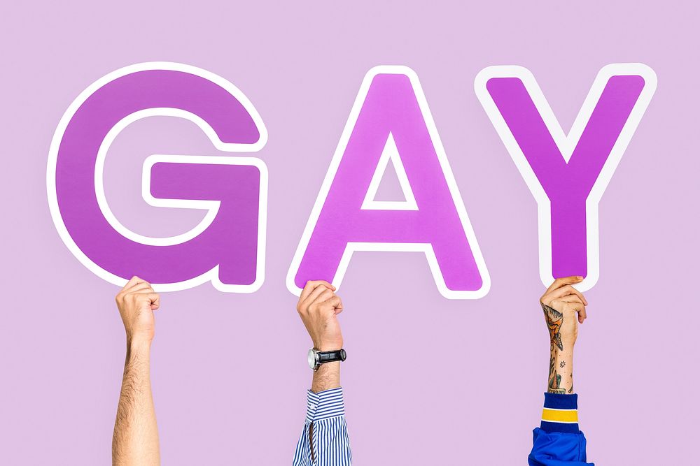 Hands holding the word gay