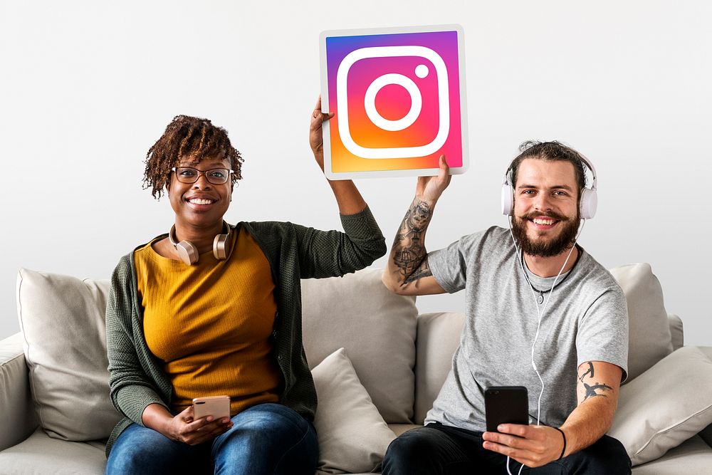 Couple showing an Instagram icon