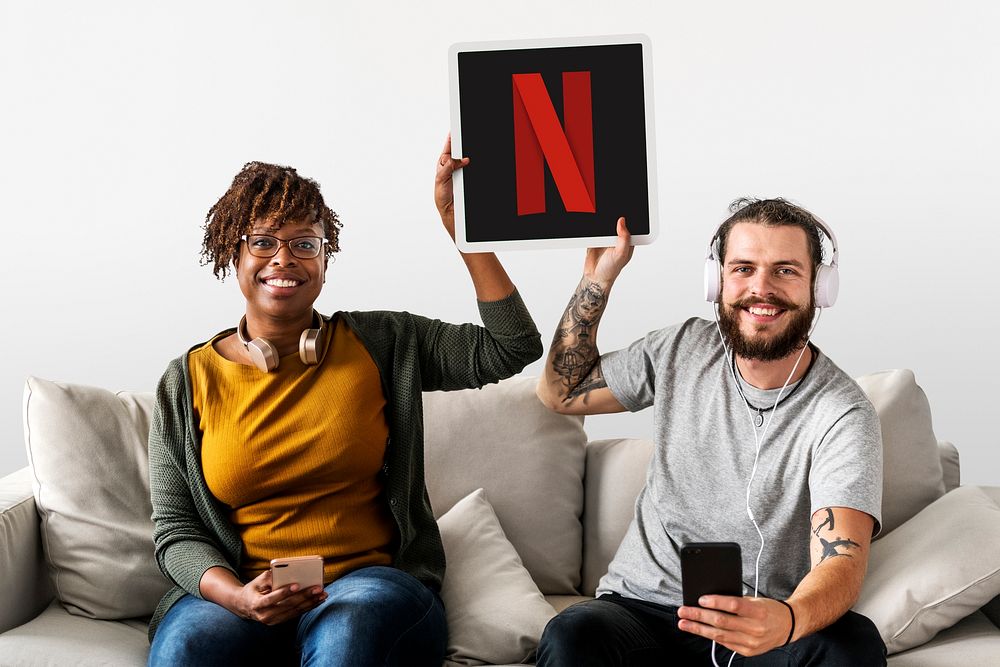Couple showing a Netflix icon