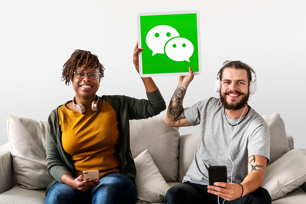 Couple showing a WeChat icon