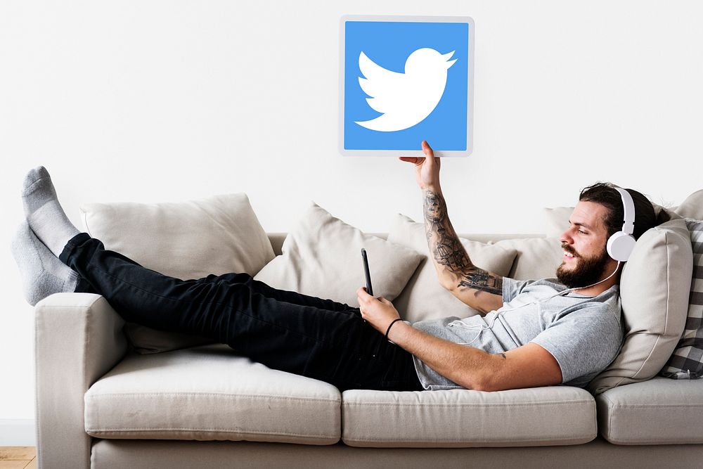 Man showing a Twitter icon