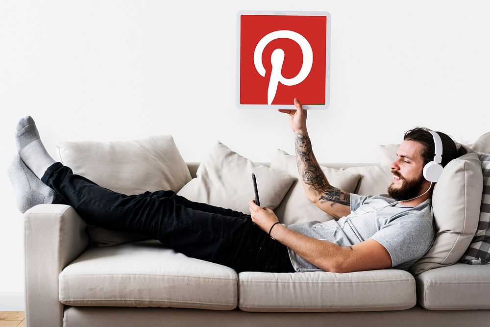 Man showing a Pinterest icon