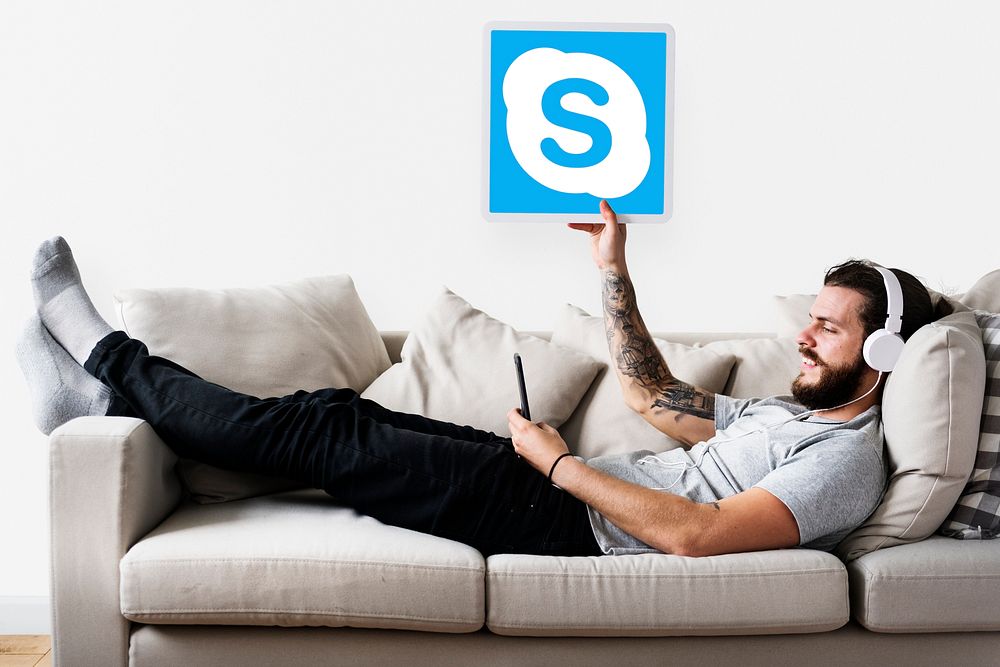 Man showing a Skype icon