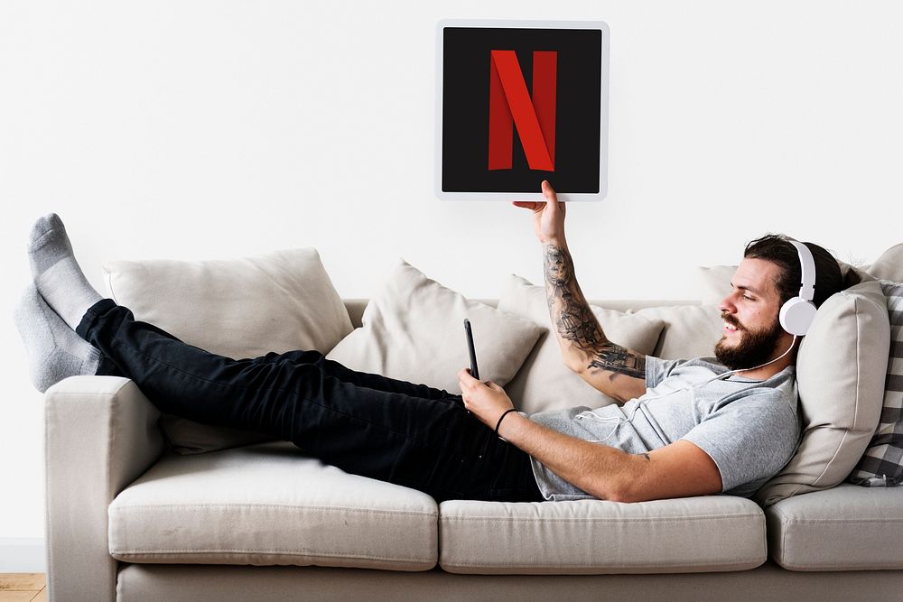 Man showing a Netflix icon