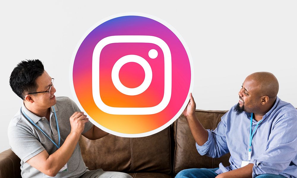 Men showing an Instagram icon