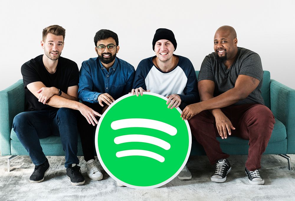 People holding a Spotify icon