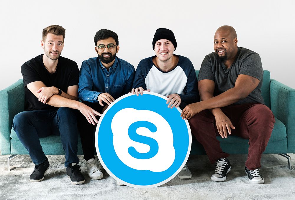 Men showing a Skype icon