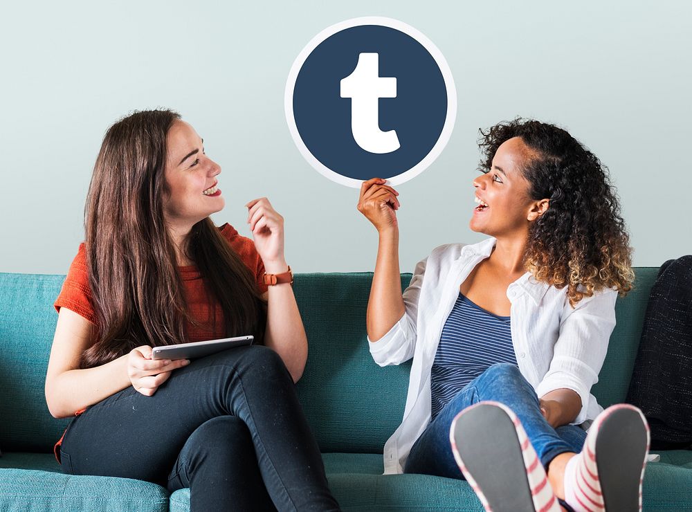 Young women showing a Tumblr icon