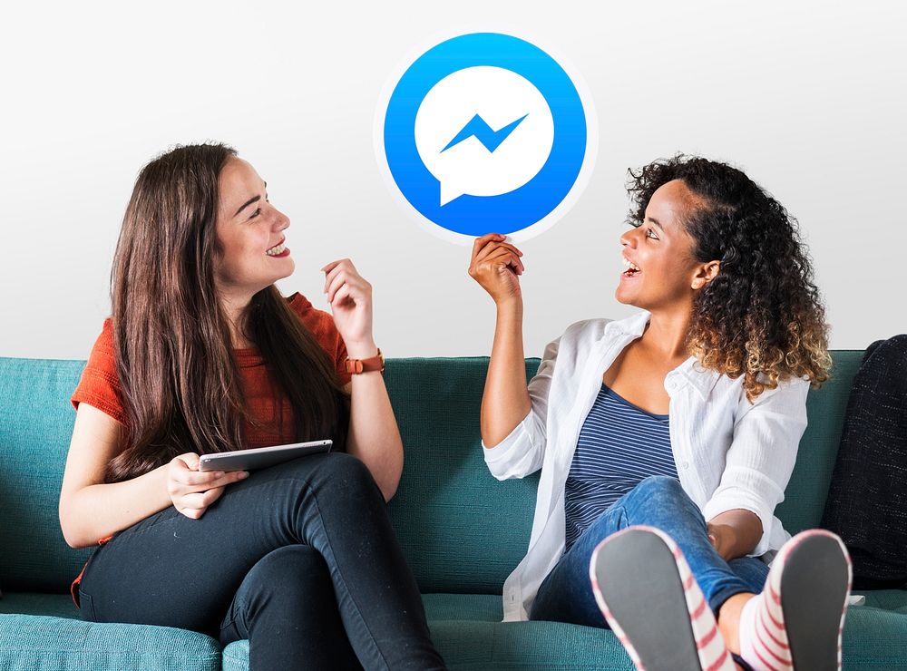 Young women showing a Facebook Messenger icon
