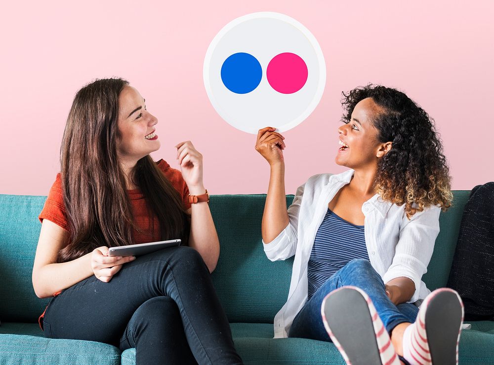 Women holding a Flickr icon