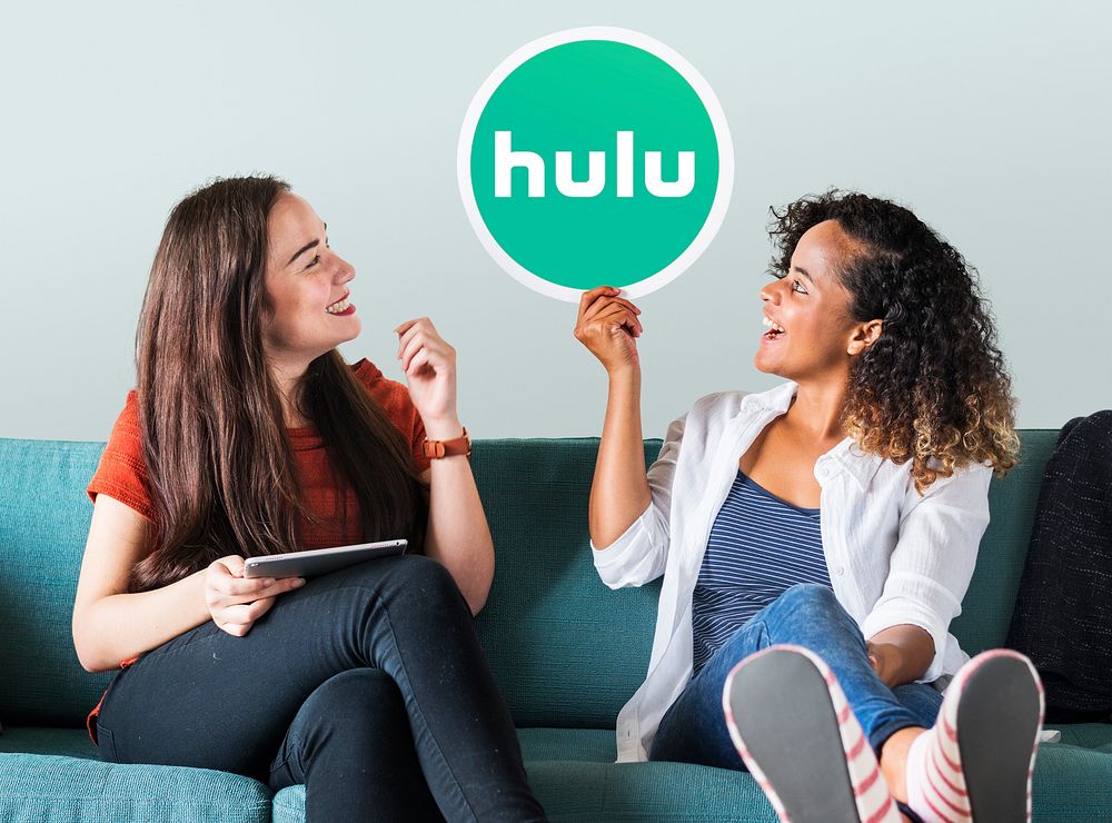 Young women showing a Hulu icon