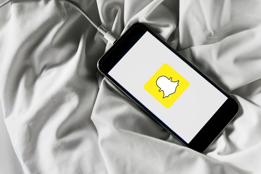 Snapchat logo showing on a phone. BANGKOK, THAILAND, 1 NOV 2018.