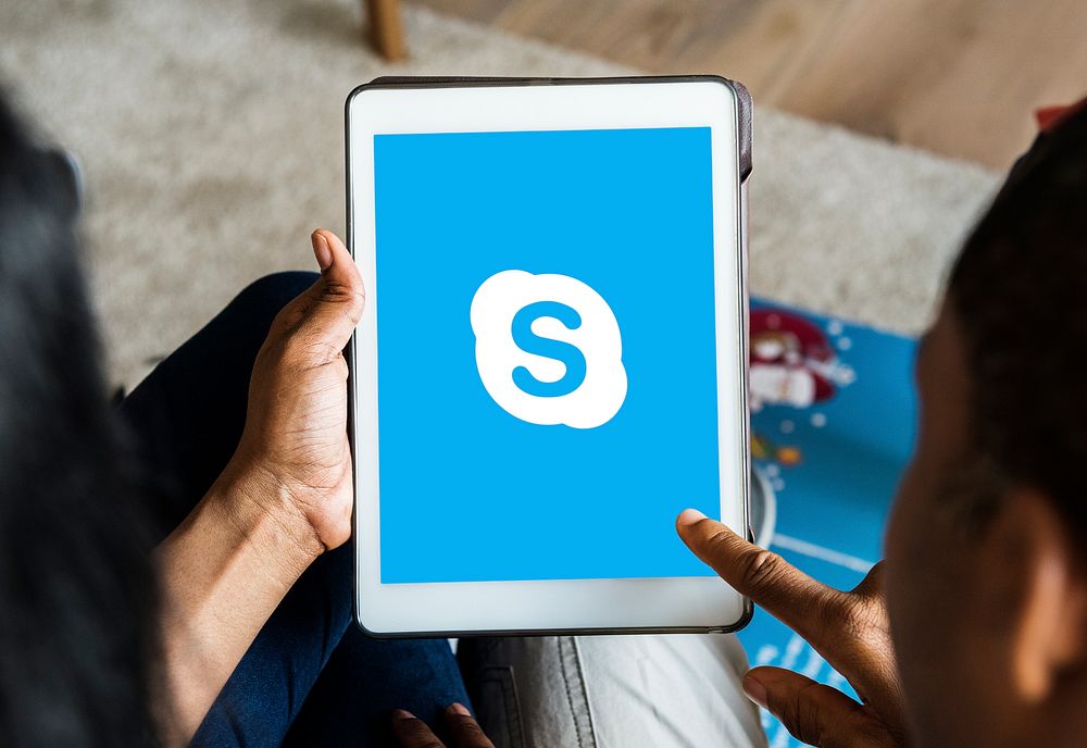 People using Skype on a digital tablet. BANGKOK, THAILAND, 1 NOV 2018.