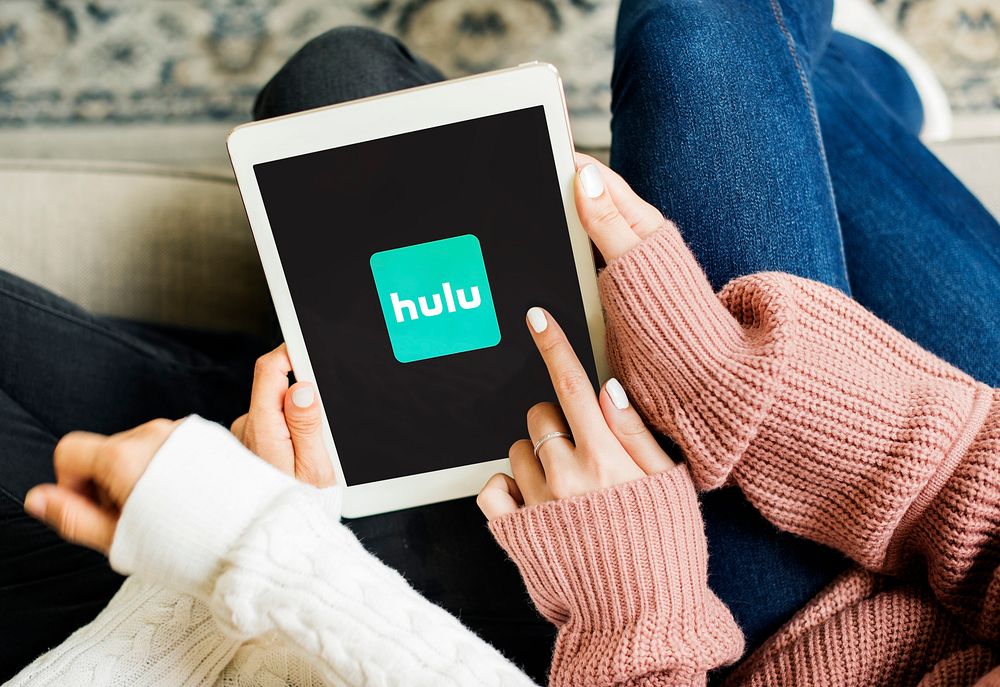 Friends watching Hulu on a digital tablet. BANGKOK, THAILAND, 1 NOV 2018.