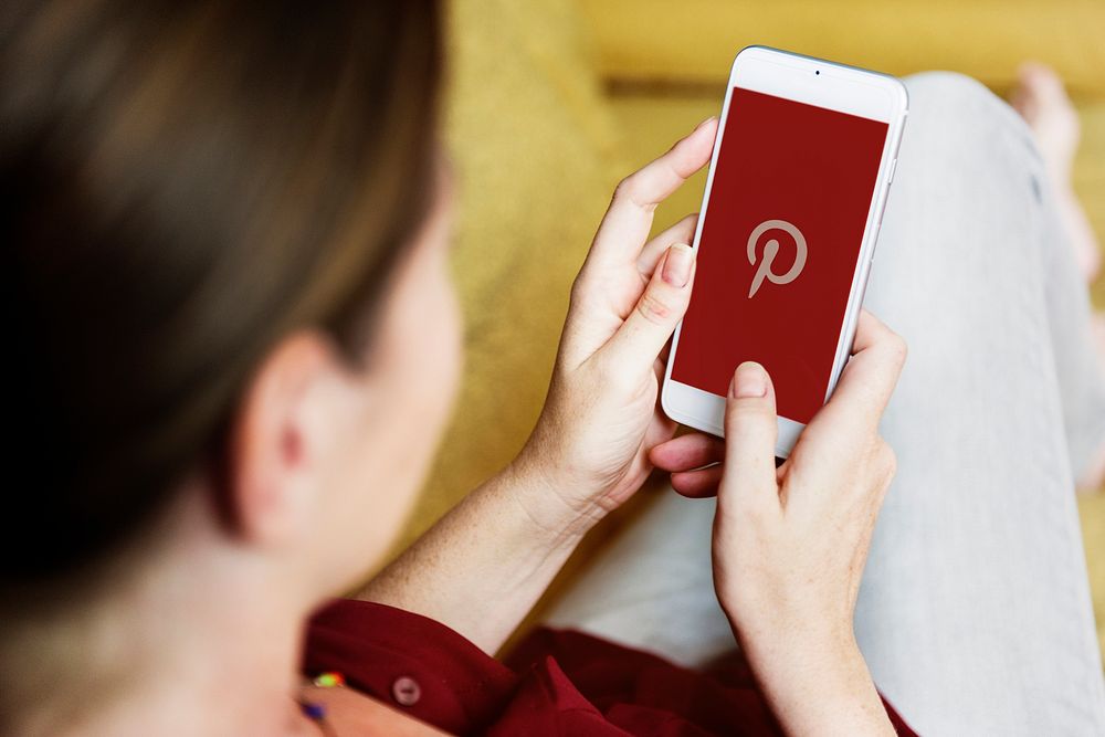 Woman using Pinterest application phone. | Premium Photo - rawpixel