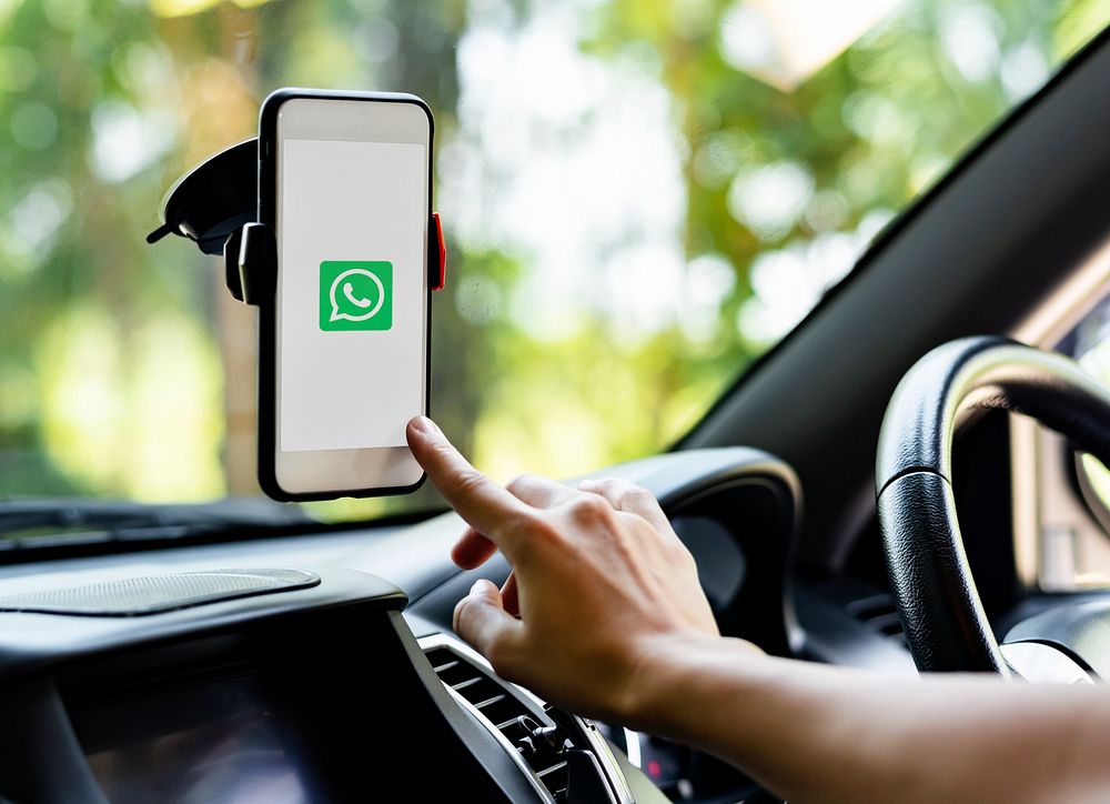 Person using Whatsapp application in a car. BANGKOK, THAILAND, 1 NOV 2018.