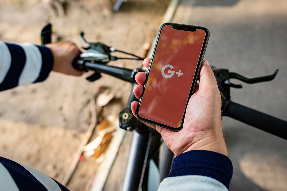 Man using Google Plus application on a bicycle. BANGKOK, THAILAND, 1 NOV 2018.