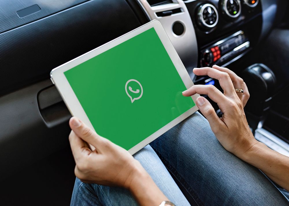 Woman using whatsapp application car free photo rawpixel