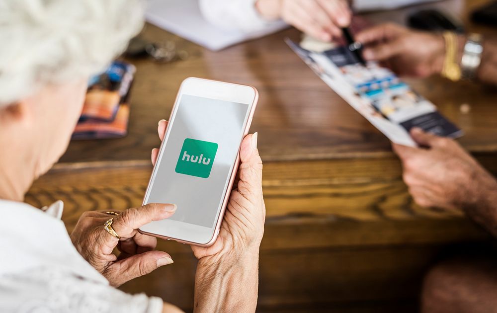 Elderly woman watching Hulu on a phone. BANGKOK, THAILAND, 1 NOV 2018.