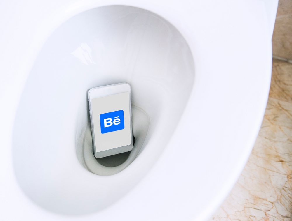 Behance logo showing on a phone placed in a toilet bowl. BANGKOK, THAILAND, 1 NOV 2018.