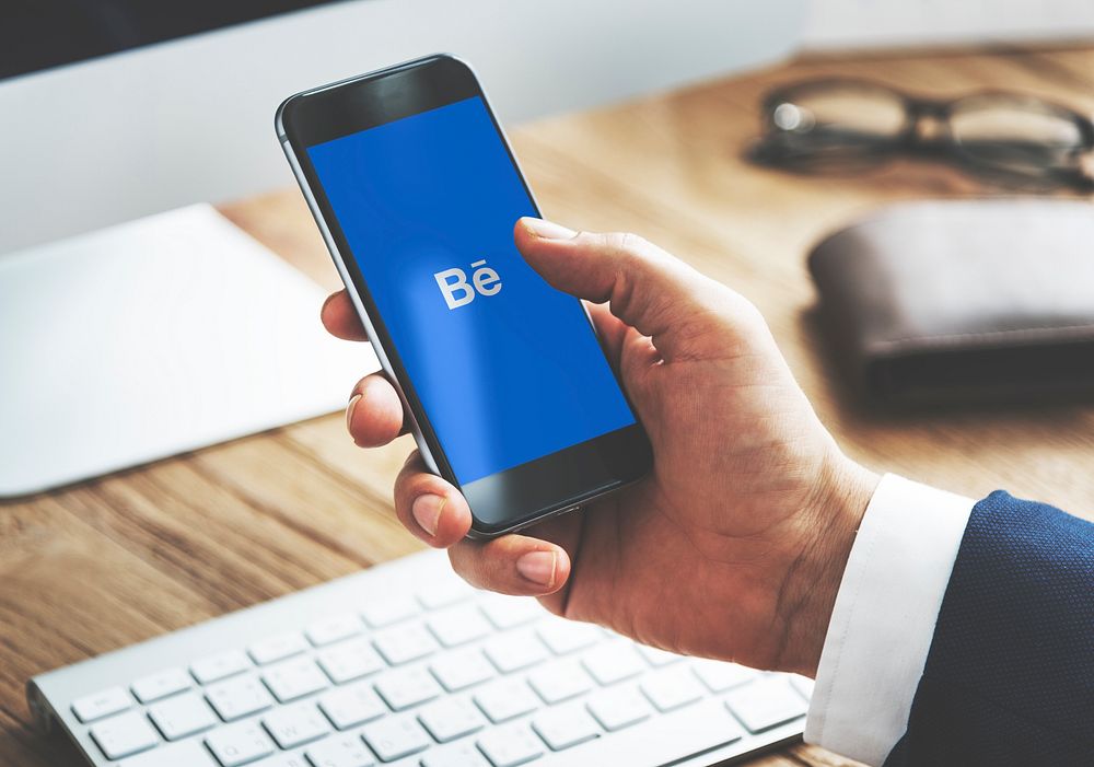 Businessman using Behance application in an office. BANGKOK, THAILAND, 1 NOV 2018.