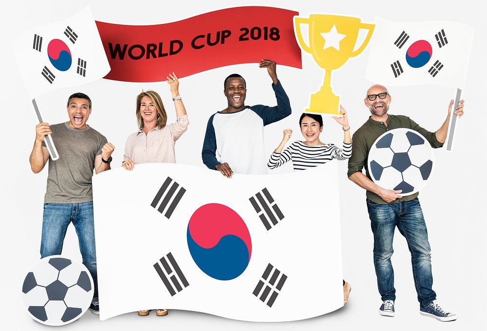 Diverse football fans holding the flag of Korea