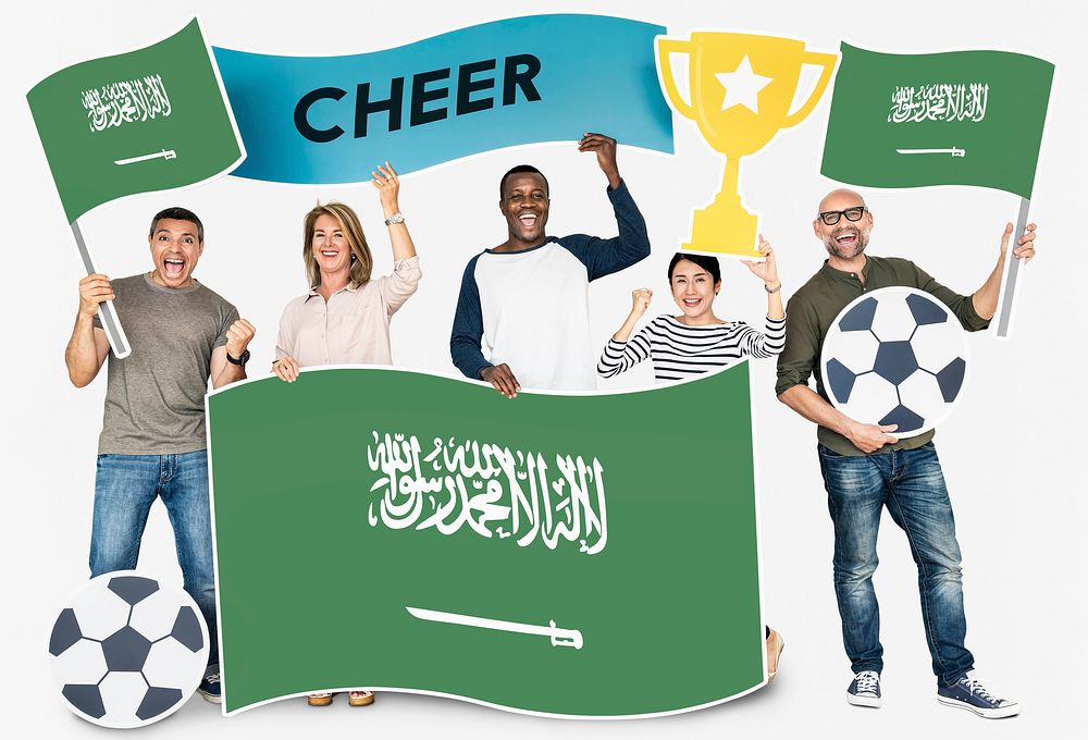 Diverse football fans holding the flag of Saudi Arabia