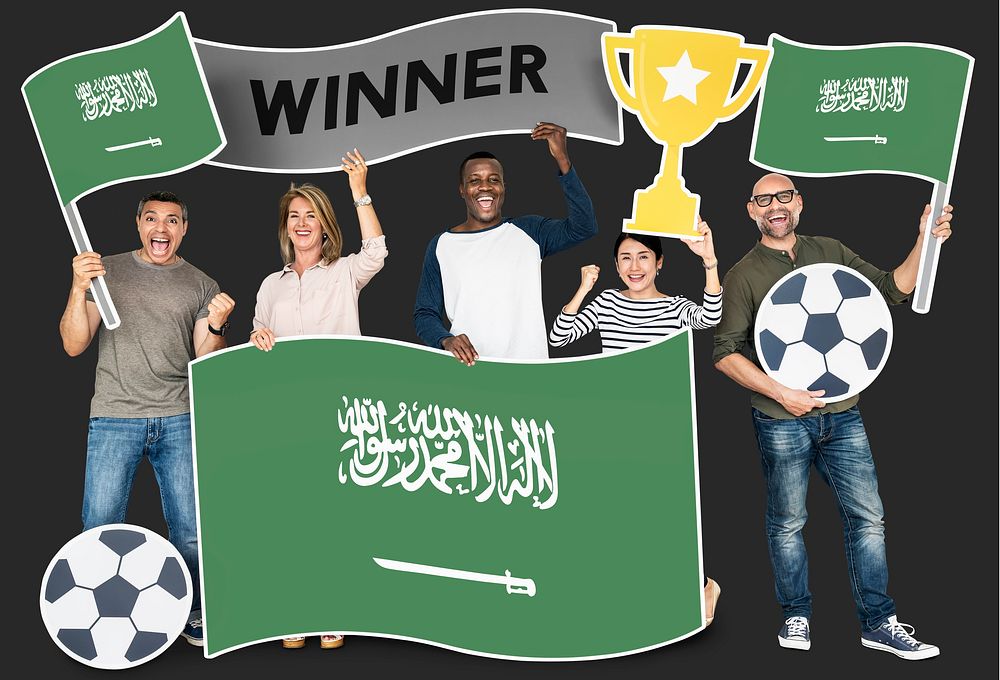 Diverse football fans holding the flag of Saudi Arabia