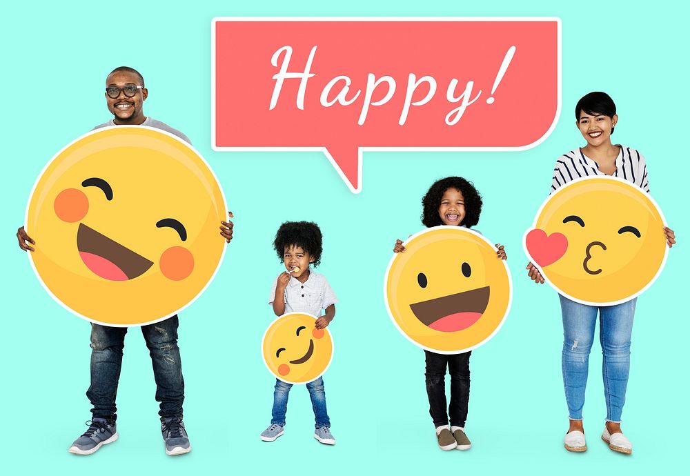 Cheerful family holding happy emoticons