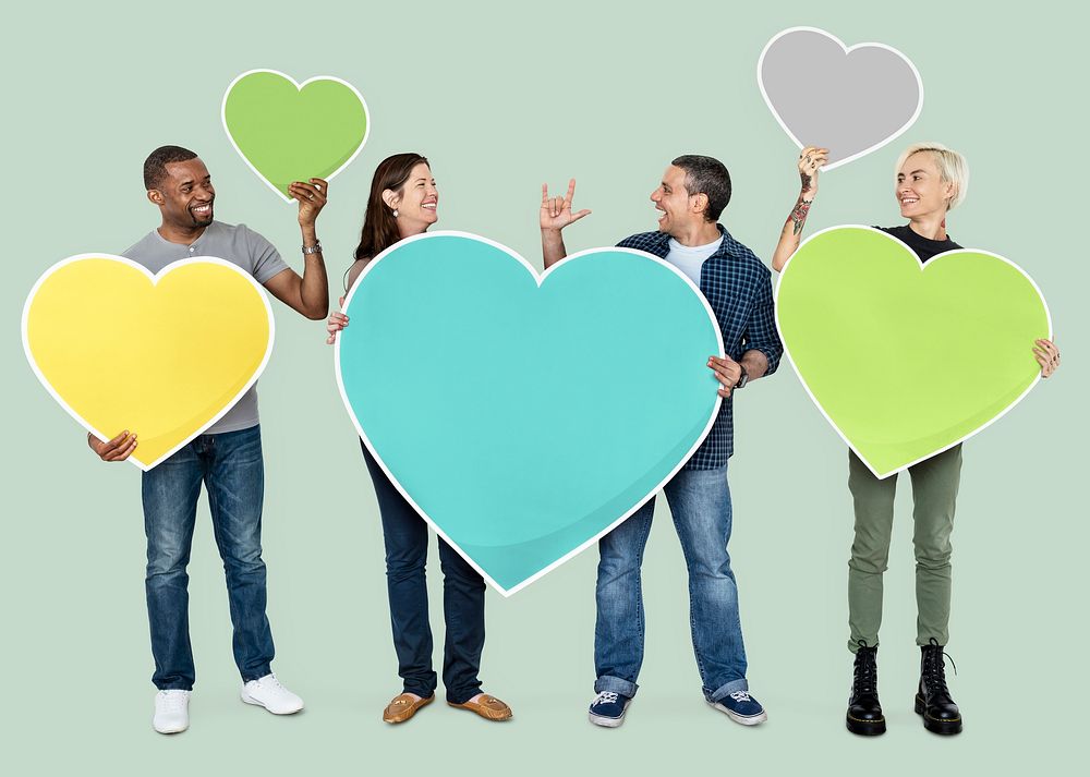 Diverse people holding colorful hearts