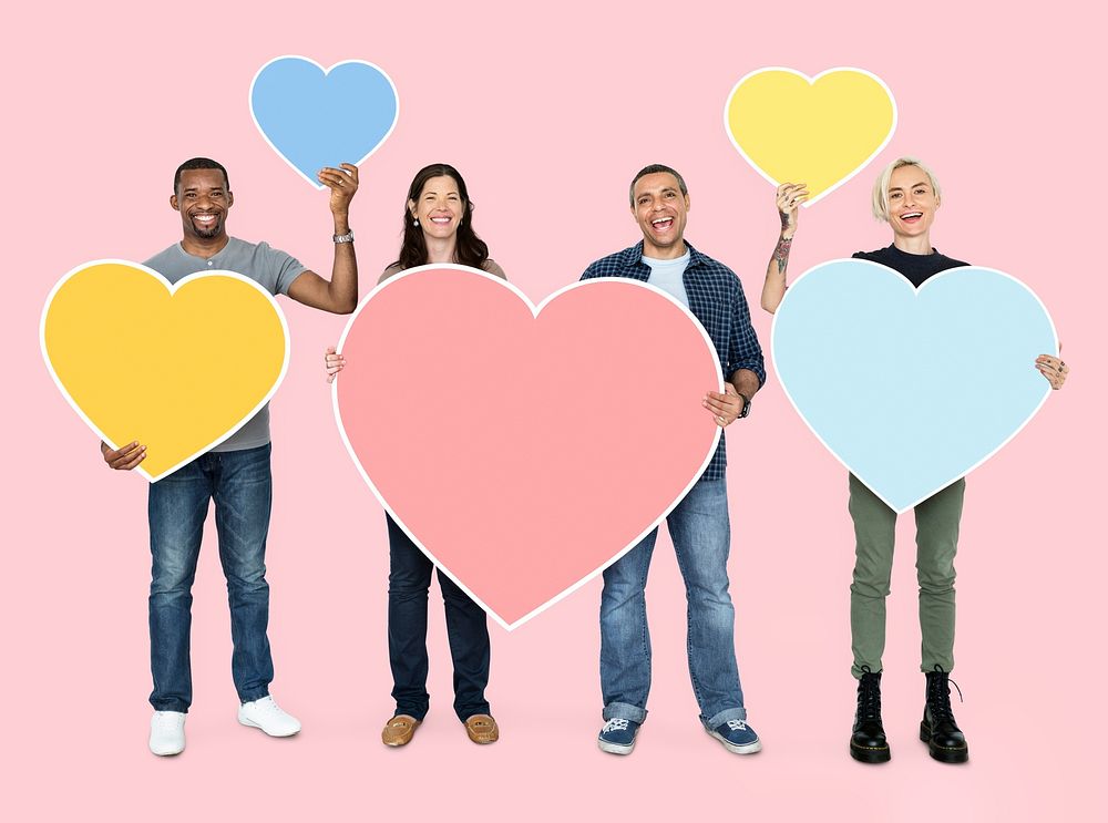 Diverse people holding heart shaped symbols