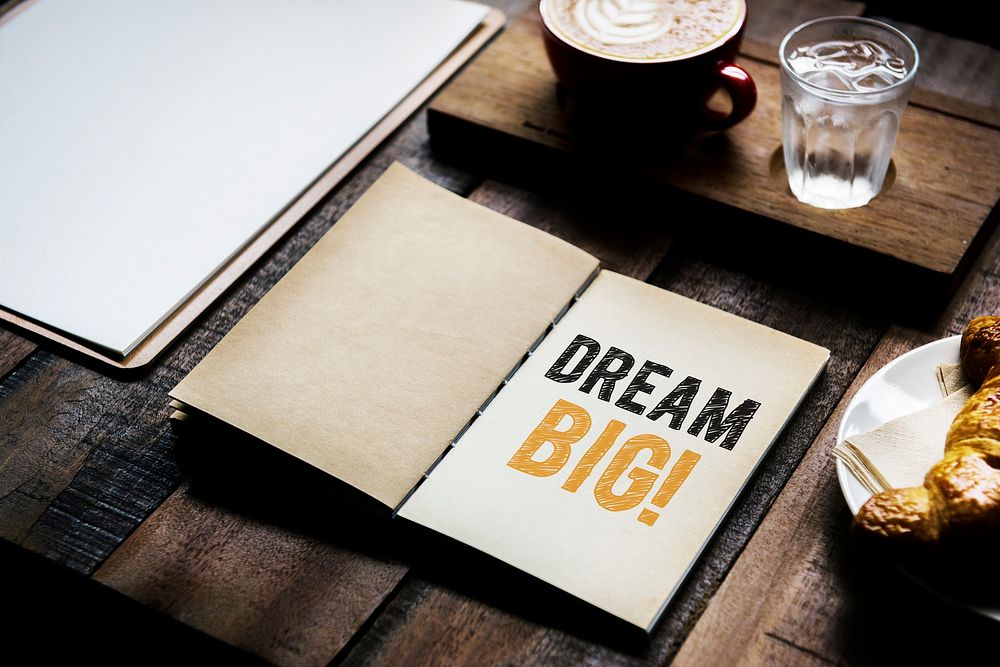 Phrase Dream big on a notebook
