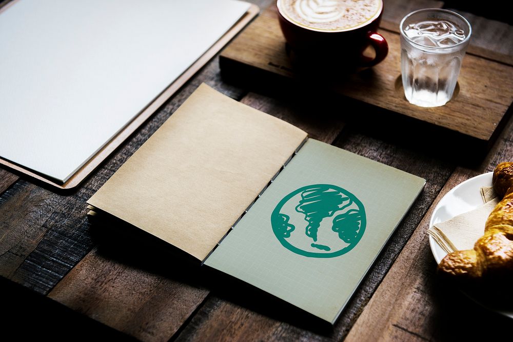 Green globe drawing on a notebook