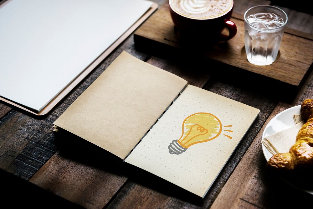 Light bulb drawing on a notebook