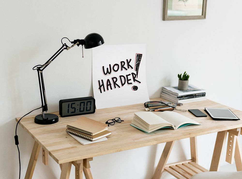Minimal style workspace with a phrase Work harder