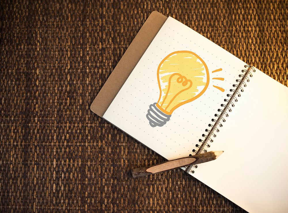 Light bulb drawn on a notebook