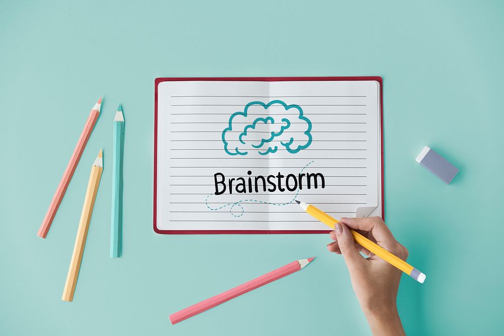 Hand writing Brainstorm on a notebook