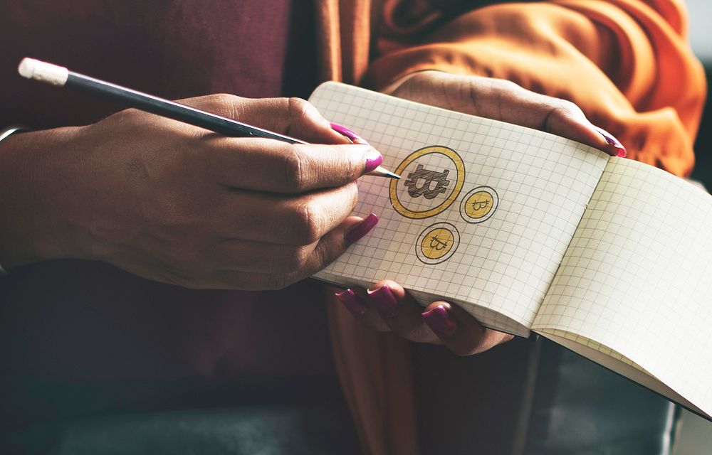Bitcoin symbols on a notepad