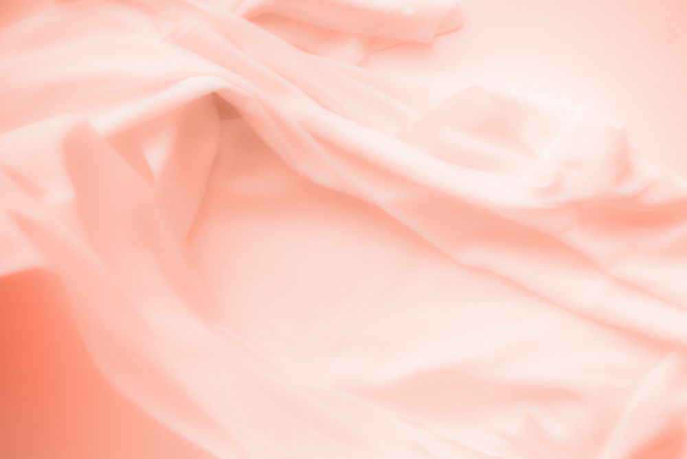 Peach satin cloth texture background 