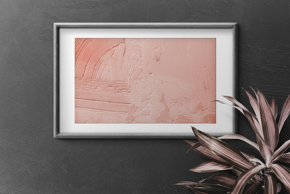 Photo frame mockup psd peach painting on black wall